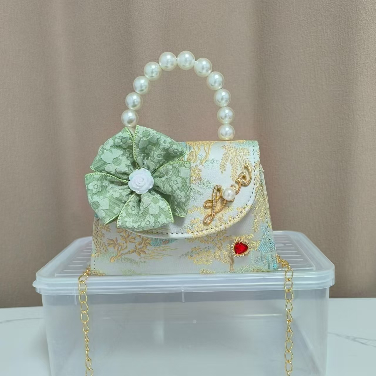 Bolsa infantil nueva niñas bolso de hombro accesorios de ropa china bolso cuadrado princesa bolso de perlas bolso arco bolso de mochila