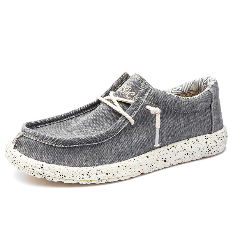 2025 al por mayor de primavera de mediana edad nuevos zapatos casuales de hombre zapatos de tela transpirables zapatos de lona PU ligeros zapatos de pedaleos