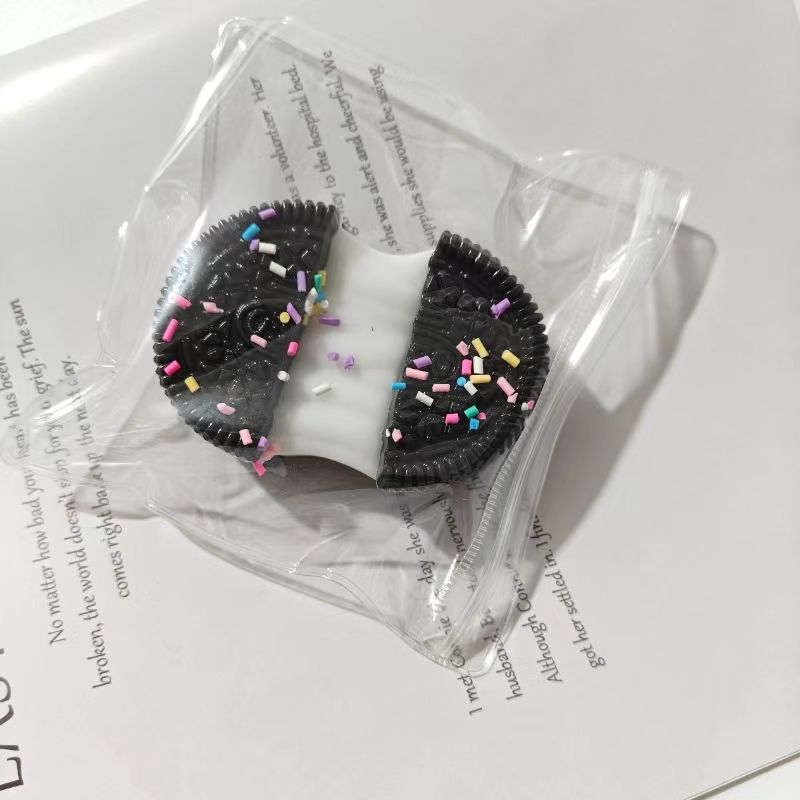 Brushed black and white sandwiched oreo with sugar sprinkles
