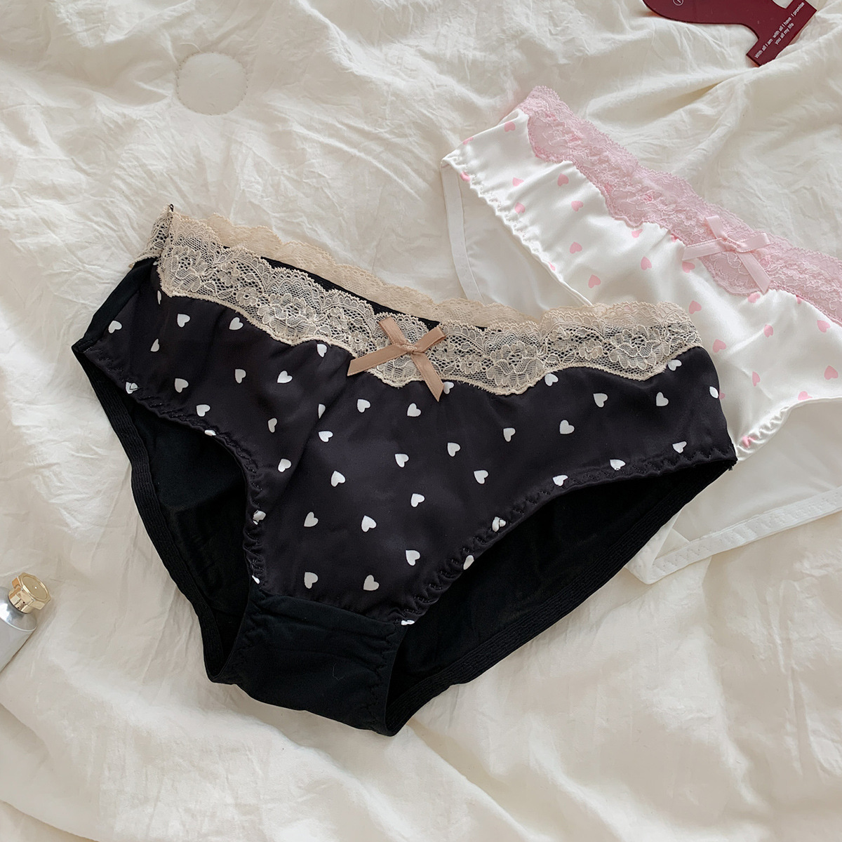Nuevo estilo francés retro sexy amor bragas de encaje puro dulce arco de cintura baja chica calzoncillos de seda de hielo