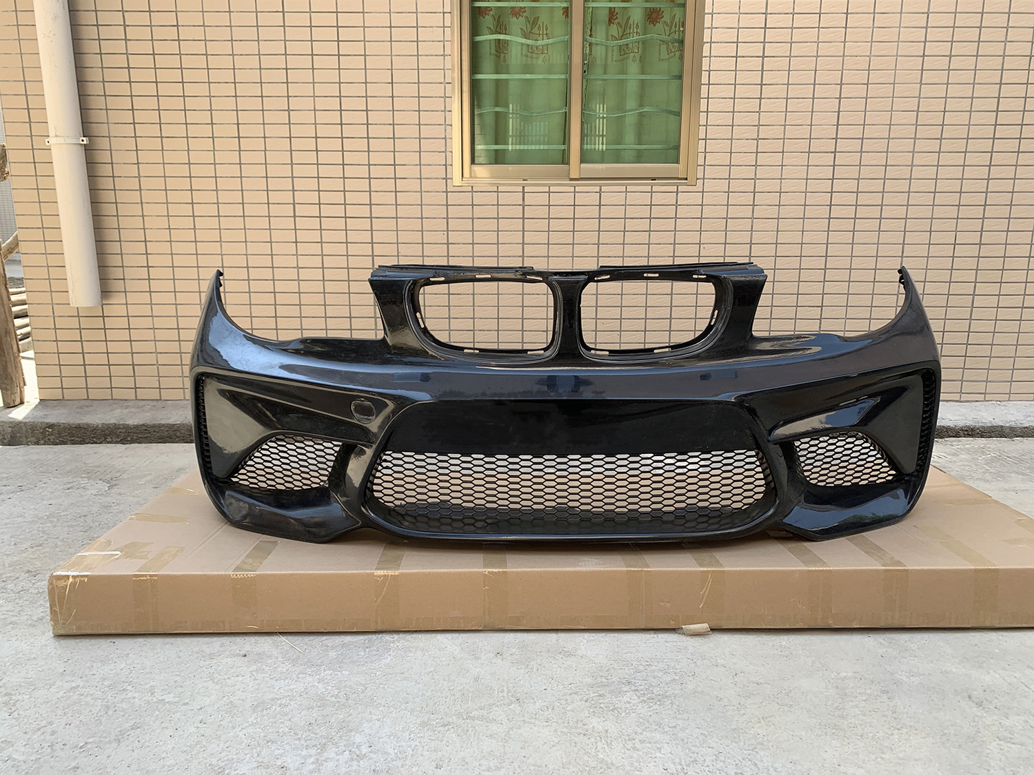 BMW 1 Series E82/E87 modified to M2 style with large body kit, front bumper and rear bumper modified for BMW