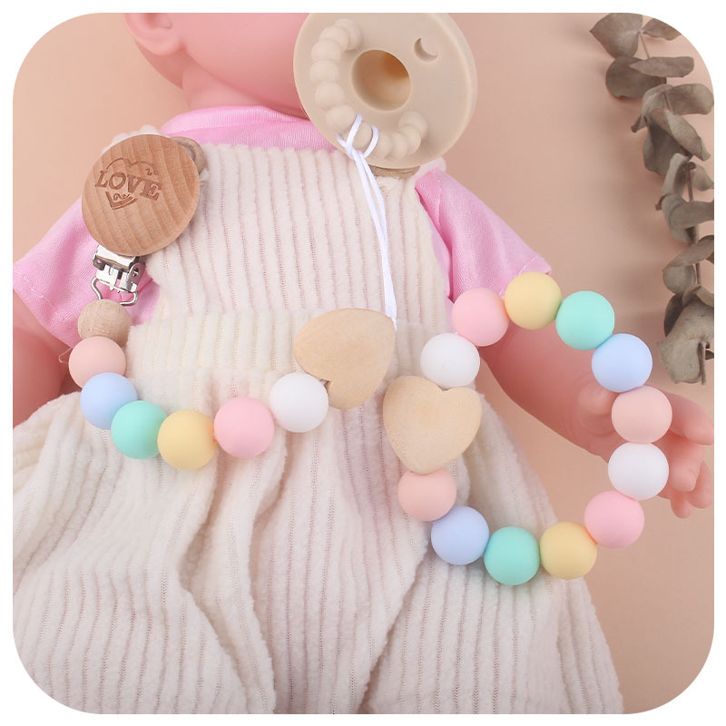 Comercio exterior nuevo bebé suministros mordedor pulsera chupete cadena traje bebé amor madera chupete cadena anti-caída