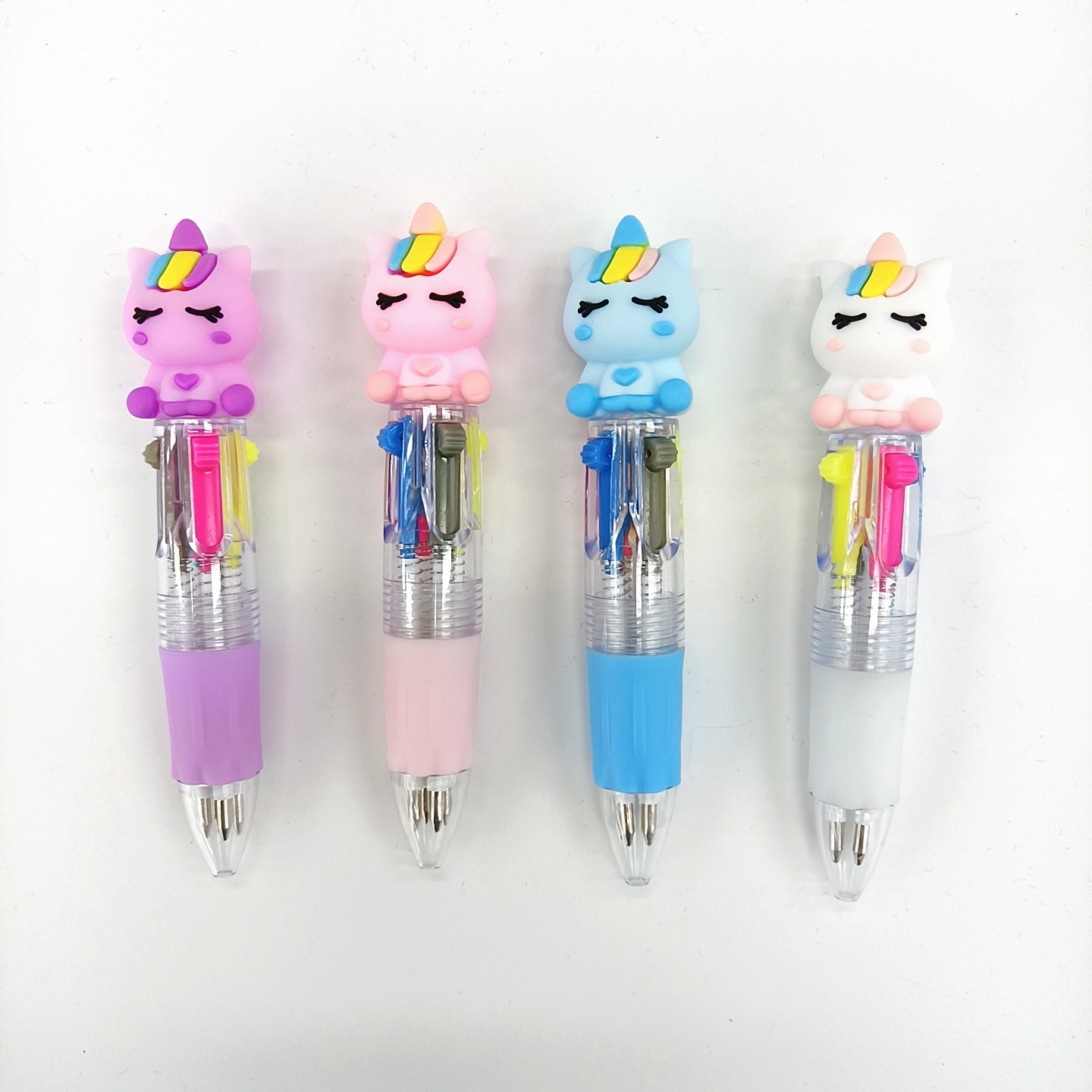 Fabricante mayorista de cuatro colores bolígrafo de silicona bolígrafo multicolor de dibujos animados cabeza portátil de estudiantes