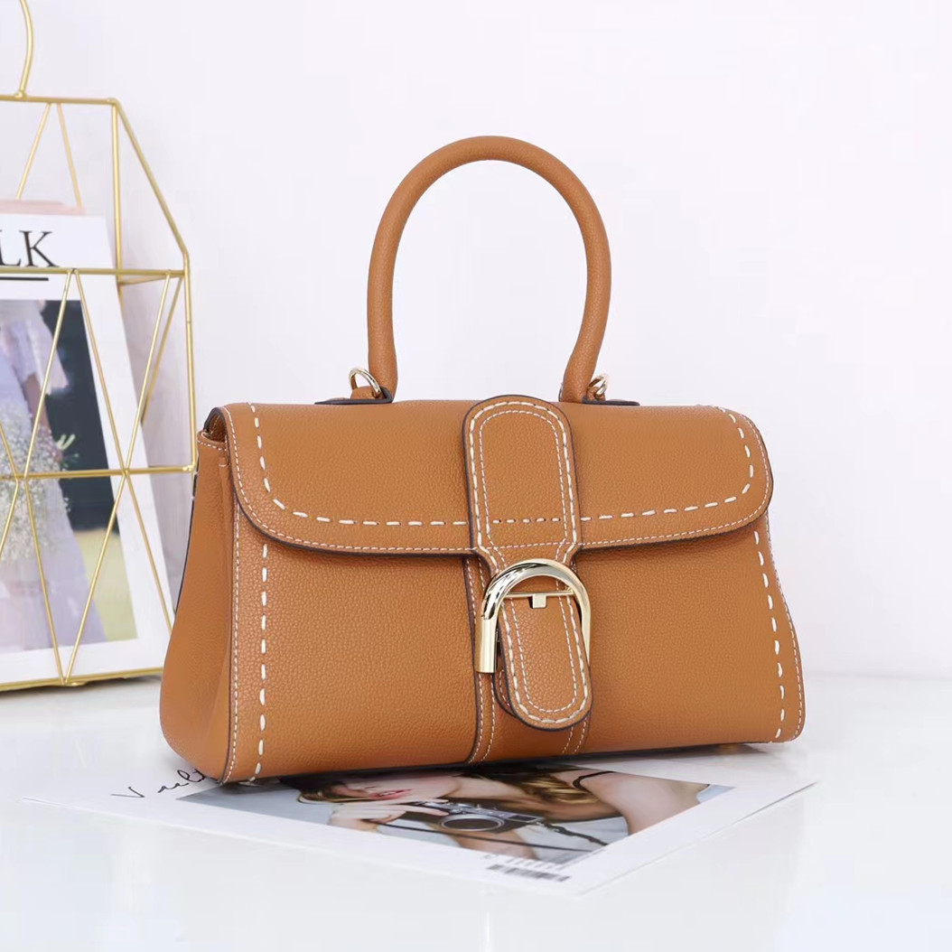 Bolso de mano con hebilla de herradura, modelo nuevo de 2025, bandolera de cuero de vaca granulado de primera capa, bolso de sillín informal y versátil.