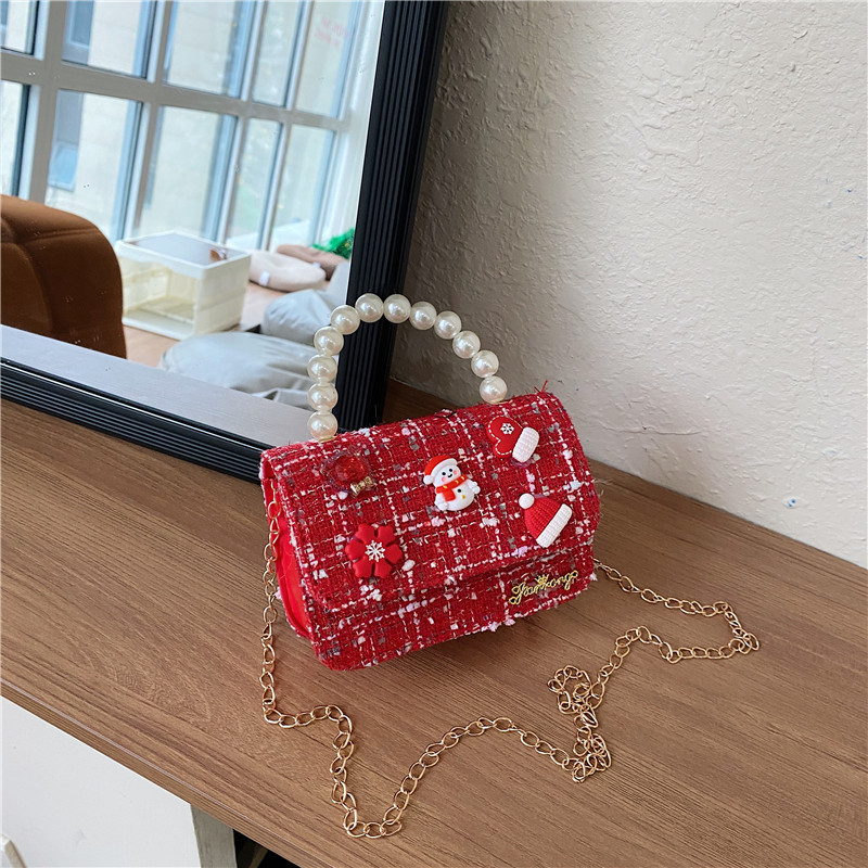 Mini moda para niñas bolso de cambio de perlas 2024 nuevo patrón de moda coreana bolso de ropa infantil
