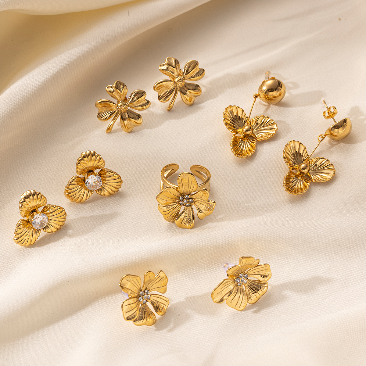 Taena Pendientes de acero inoxidable europeos y americanos Sensación simple y de alto nivel Pendientes de acero de titanio de flores de textura de moda para damas al por mayor transfronterizo
