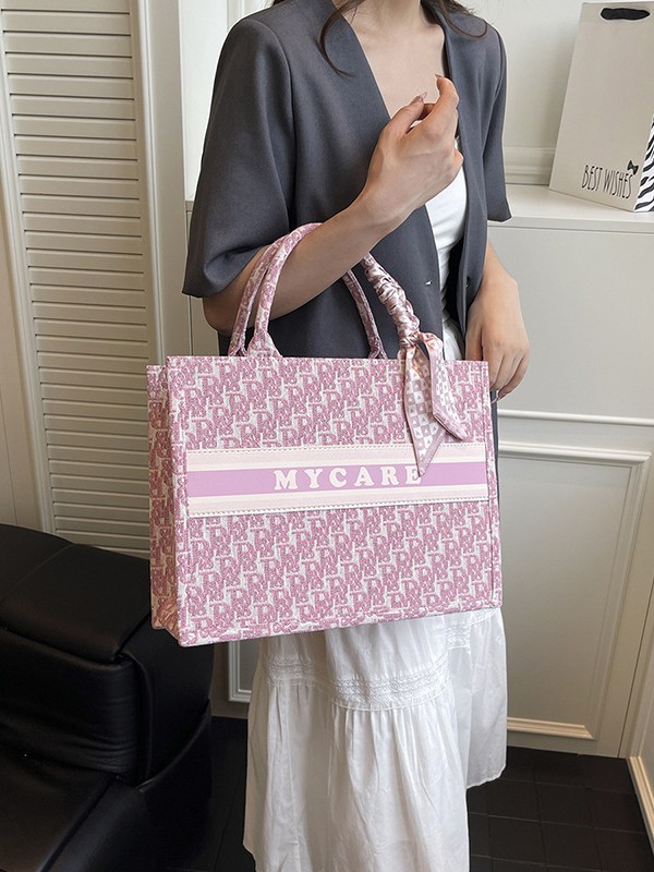 Bolsos bordados de alta calidad para mujeres 2026 nuevas letras de tela transfronterizas retro bolsas de mano de transporte de gran capacidad