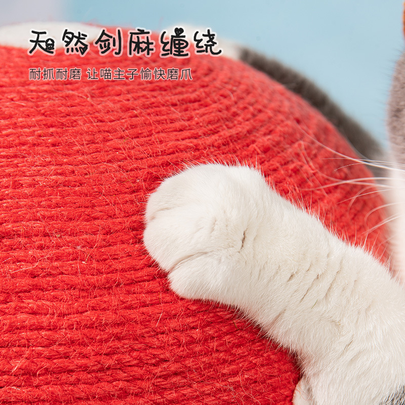 新年の赤い傘のキノコの猫は棚の剣の麻を登って爪の猫をつかんで板をつかみません。|undefined