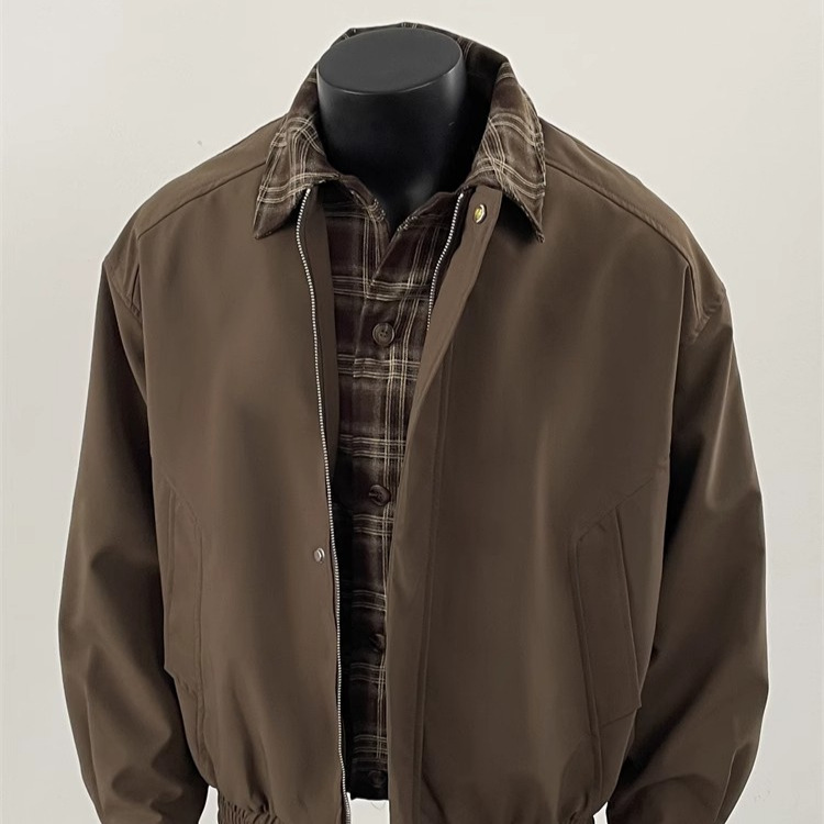 Chaqueta de diseño de nicho de otoño de pareja de contraste de dos piezas falsas de la marca de moda de la calle 2025 nuevo estilo americano