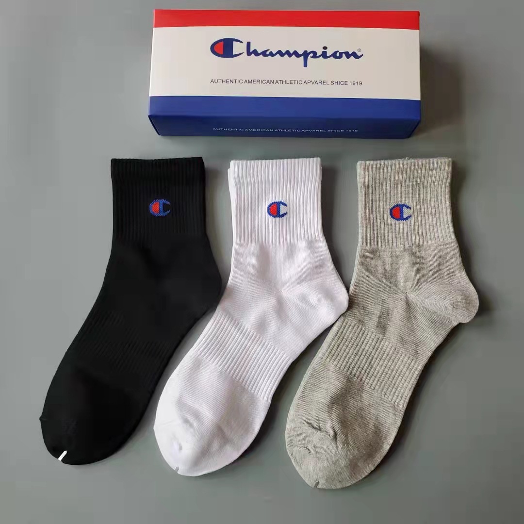 Five pairs of boxed champion black and w...