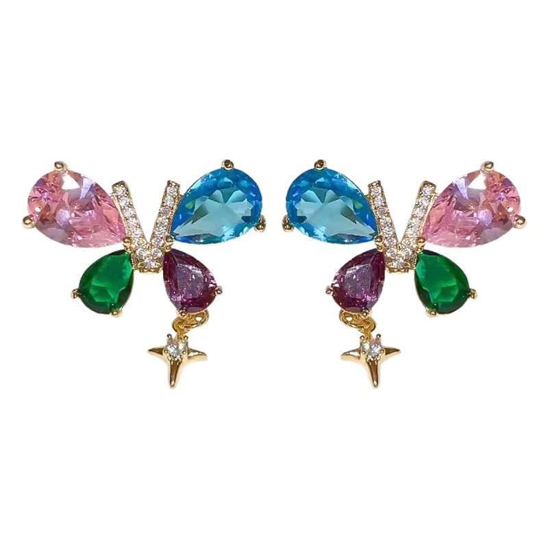Pendientes de mariposa coloridos 2023 nuevas mujeres de lujo ligero de alto grado nicho de diseño de moda pendientes de estrellas del todo fósforo