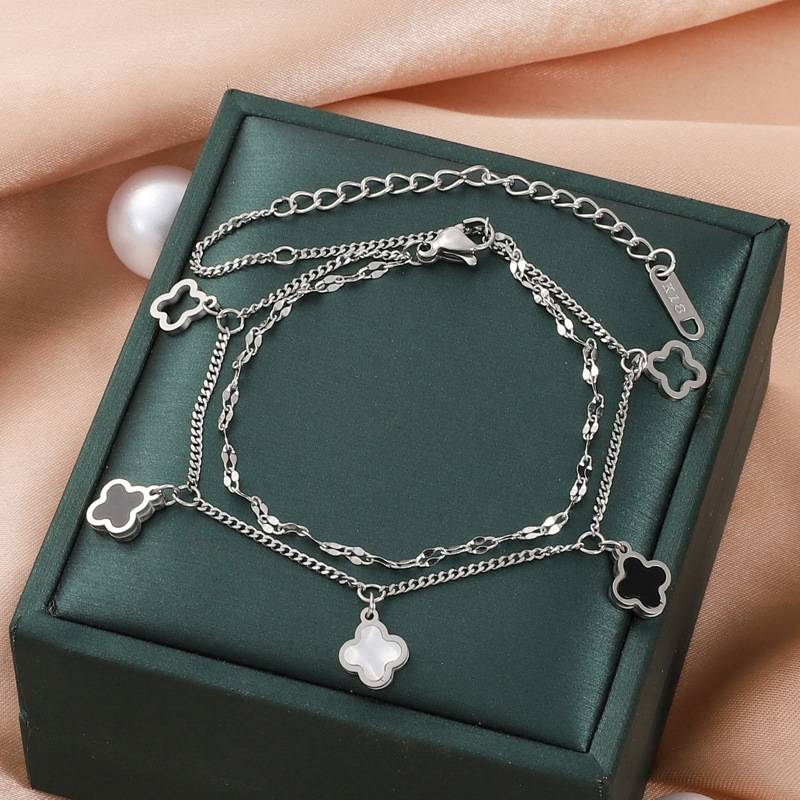 Europa y los Estados Unidos venta transfronteriza caliente de acero de titanio tetrahedral hueco conchas colgante pulsera no decoloración pulsera de diseño avanzado al por mayor