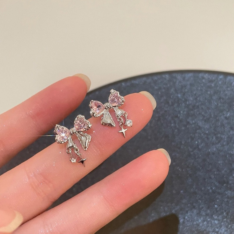 Small design fashionable elegant earrings with bow with zircon