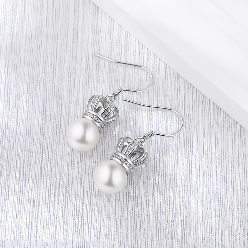Nuevo tipo transfronterizo de plata esterlina 925 pendientes de perlas de corona retro nicho de moda femenina alta sensación de temperamento diversificado pendientes