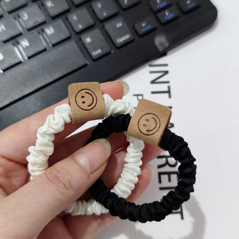 Brown smiley hair band