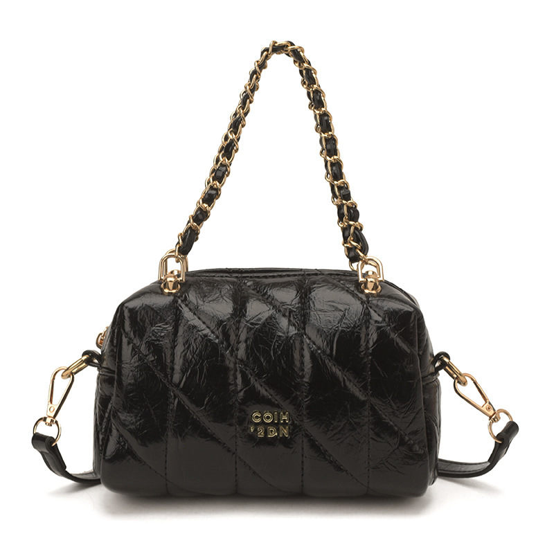 Bolsa de estilo de viaje de cadena de diamante para mujeres 2026 nueva sensación diaria de estilo extranjero bolso de hombro otro medio