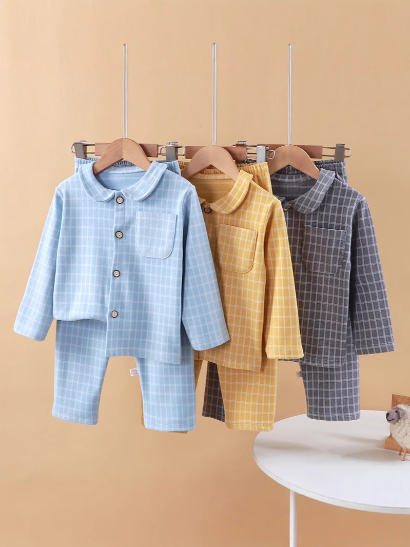 Nuevos productos para niños de otoño y invierno cuadrado de manga larga pijamas sueltos cuadrados de camisa caliente para niños pijamas para el hogar