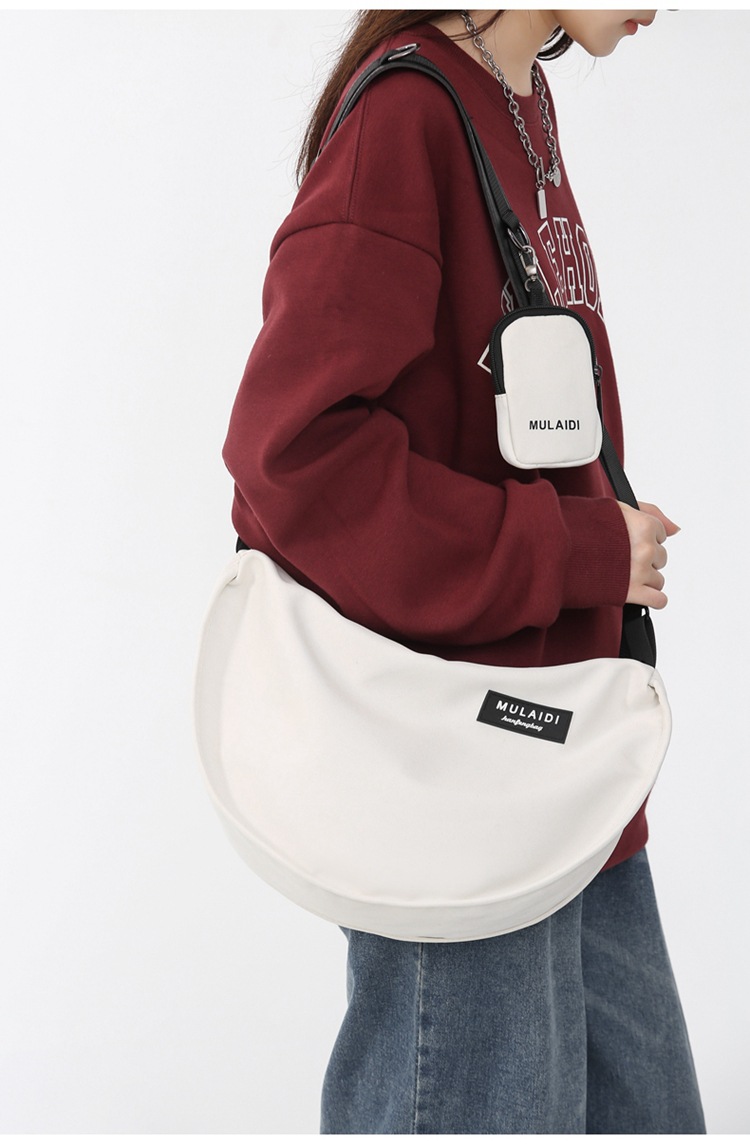 Japanese-style casual dumpling bags, sporty crossbody bags, large-capacity canvas bags for women, single-shoulder commuting bags for students to class, trendy undefined