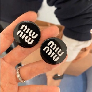 Black earrings with letters