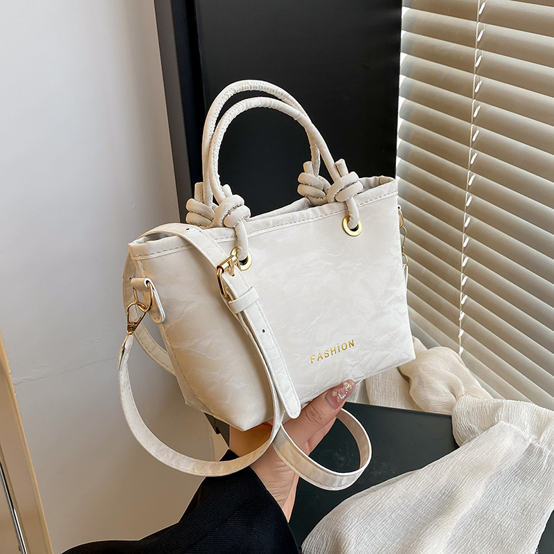 Tendencia versátil bolso de hombro 2025 nuevo estilo de moda casual bolso de cubo de mano para mujeres coreanas bolso de mochila simple para mujeres