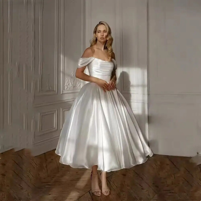 Off-the-shoulder travel photography light wedding dress with tie-back, new simple solid color elegant party dress with a puffy skirt Off-the-shoulder travel photography light wedding dress with tie-back, new simple solid color elegant party dress with a puffy skirt