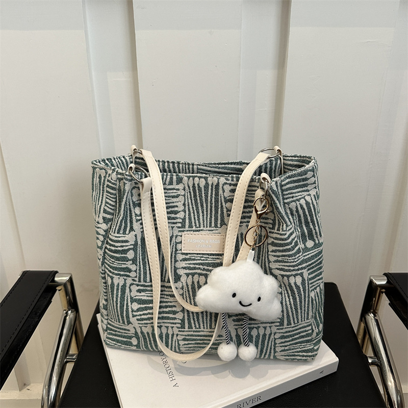 Bolso a rayas casual de todos los partidos de nicho para mujer 2024 nuevo bolso de hombro de gran capacidad de moda retro bolso de viaje