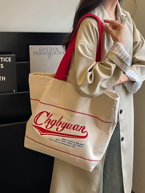 Bolsa de lona para mujeres 2026 nueva bolsa de hombro portátil simple y versátil bolsa de viaje de clase diaria