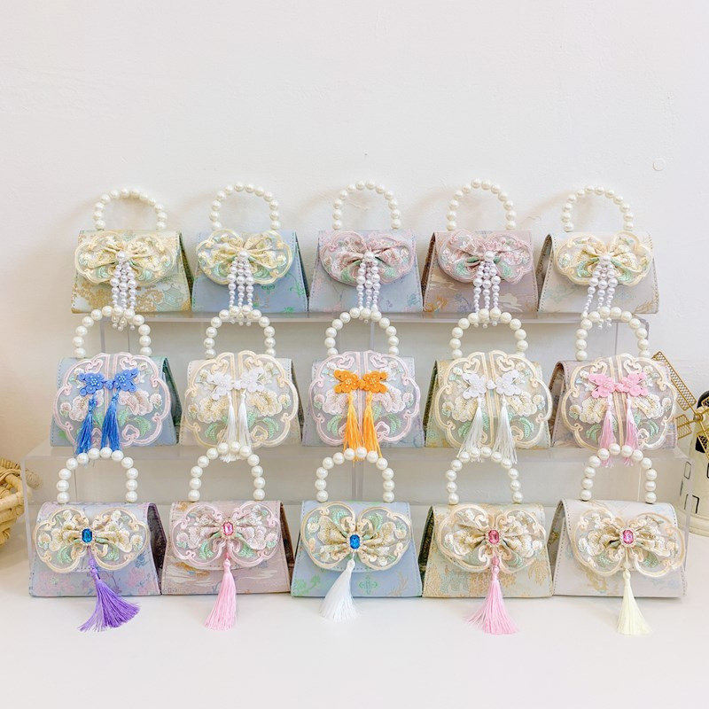 Bolso bandolera para niñas de estilo chino nuevo bolso bandolera para niños con borla portátil de perlas 2024 nuevo bolso de cadena para niños