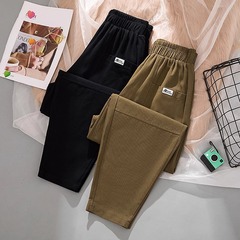 大きいサイズの純綿のカジュアルなズボンの女性の春夏の秋のタイプの女性のズボンはゆったりしています。
