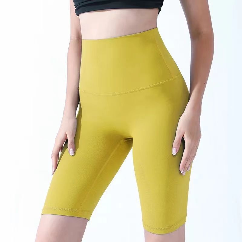 Pantalones cortos desnudos de mujer elásticos apretados para elevar las caderas de cinco puntos pantalones deportivos de secado rápido succión de sudor entrenamiento para correr fábrica de comercio de ping