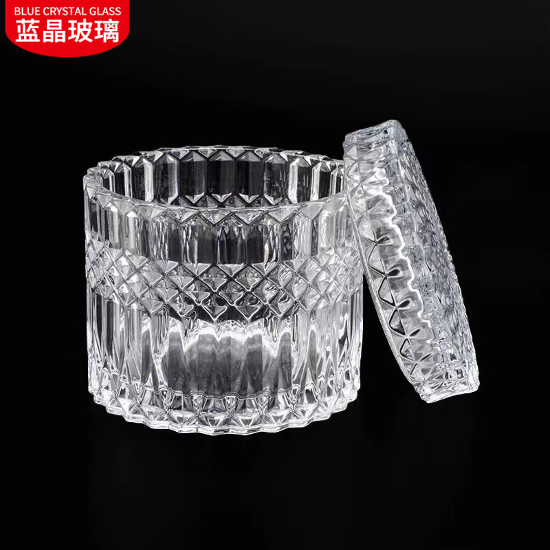 En stock suministro de embalaje independiente de vidrio transparente candelabro tarro de caramelo en relieve patrón cubierta de vidrio taza de vela