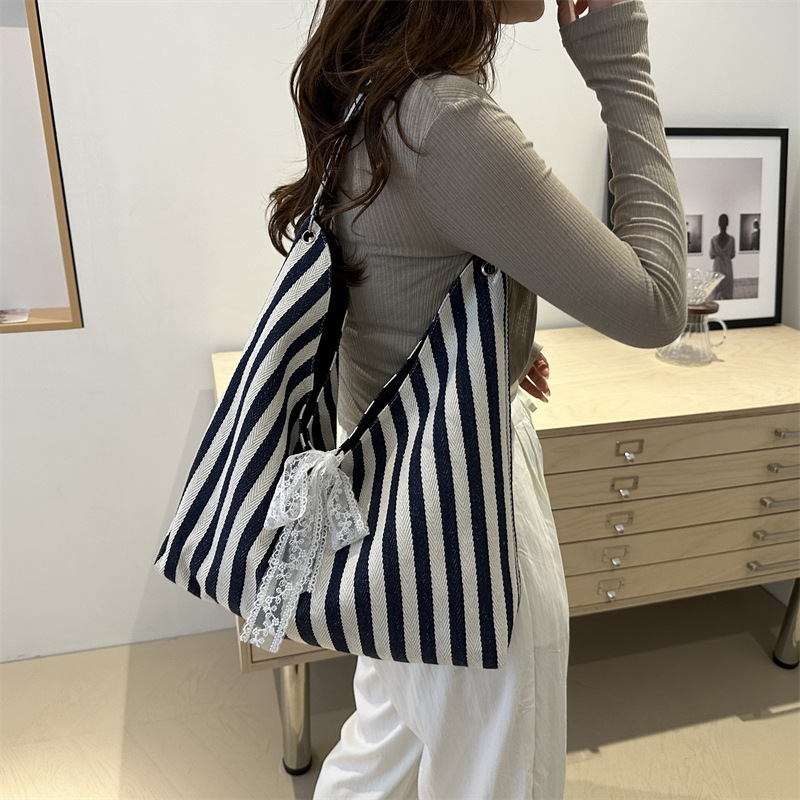 Bolsa de lona a rayas para mujeres verano 2024 nueva moda nicho coreano bolso especial bolso de tela de gran capacidad para estudiantes