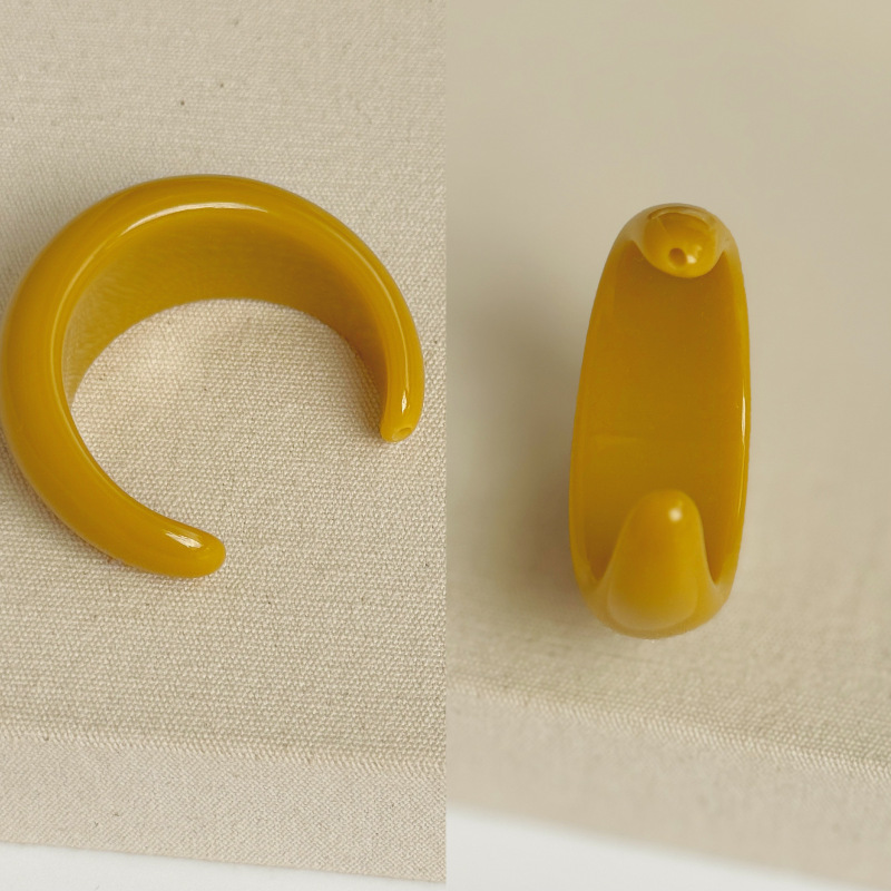 A pair of mustard yellow [big hole accessories]