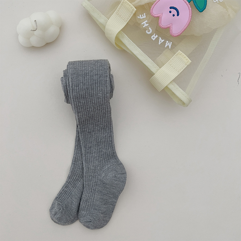 Nuevo color sólido rayas verticales polainas de las muchachas del otoño y el invierno estilo coreano ocasional los niños ropa exterior pantimedias blancas en stock