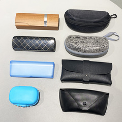 A pair of sunglasses accessories for special order, Model 22 new black and white leather snap-fastener sunglasses case