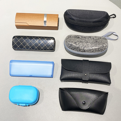 A pair of sunglasses accessories for special order, Model 22 new black and white leather snap-fastener sunglasses case