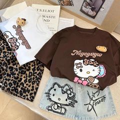 女の子の夏のセット2025新しい女の子の漫画のプリントtシャツのかわいいプリントのデニムのスカートの2つのセット