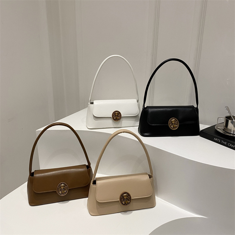 Bolsos retro de estilo extranjero para mujeres otoño y invierno 2024 nueva moda literaria bolsas de brazo de diseño de nicho bolsas de hombro