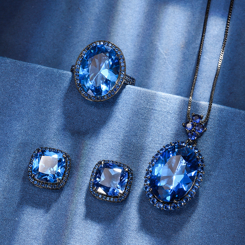 2024 nuevo Zhuang Sheng joyería fondo de cobre chapado en oro simulación azul puntiagudo cristal negro oro personalidad traje 13*18-12*16