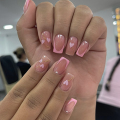 Mid-to-long length square-shaped pastel pink girly nail art with heart motifs and gold-threaded faux nails—wholesale nail tips