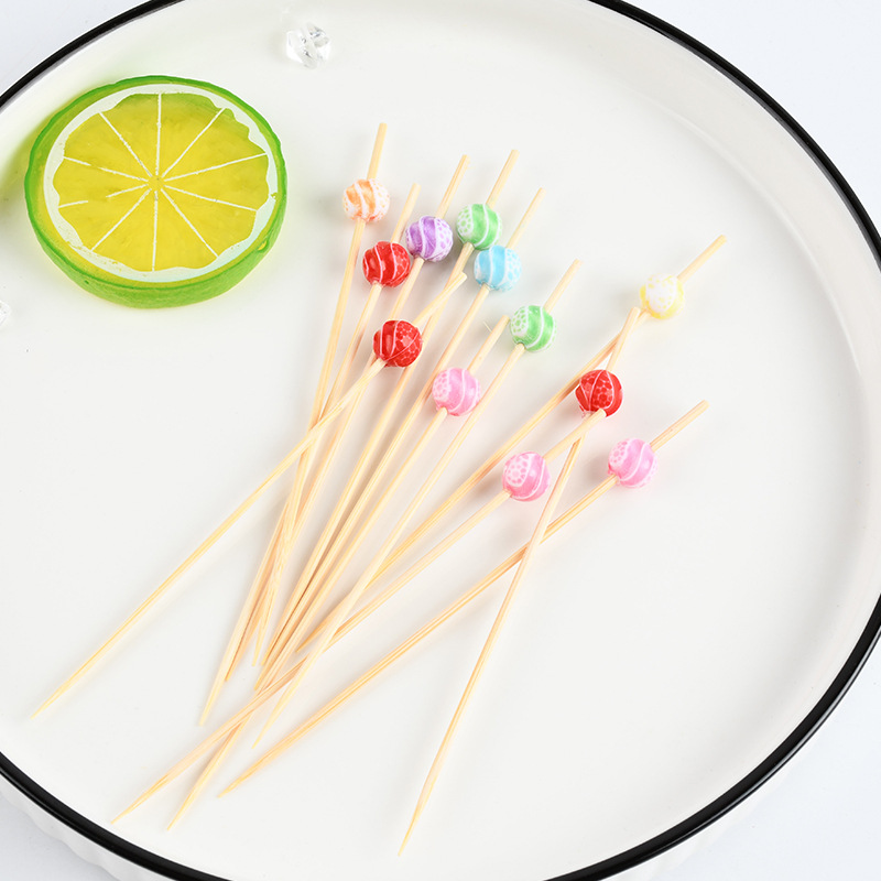 Suministro spot cuentas de color desechables horquilla de fruta de dibujos animados bocadillos de fruta palillos de dientes de arte string stick stick stick bambú