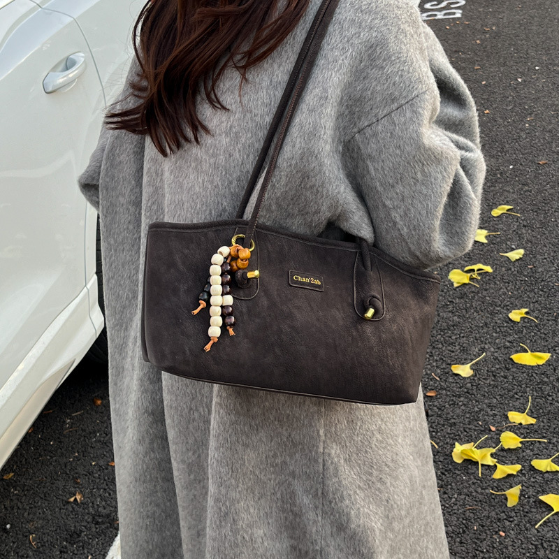 Bolsa de hombro casual coreana de nicho retro simple bolsa de brazo de viaje para mujeres 2025 nueva moda bolsa de mano