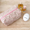 Fuchsia cosmetic bag for traveling, storage system with zipper, handheld storage bag, tape