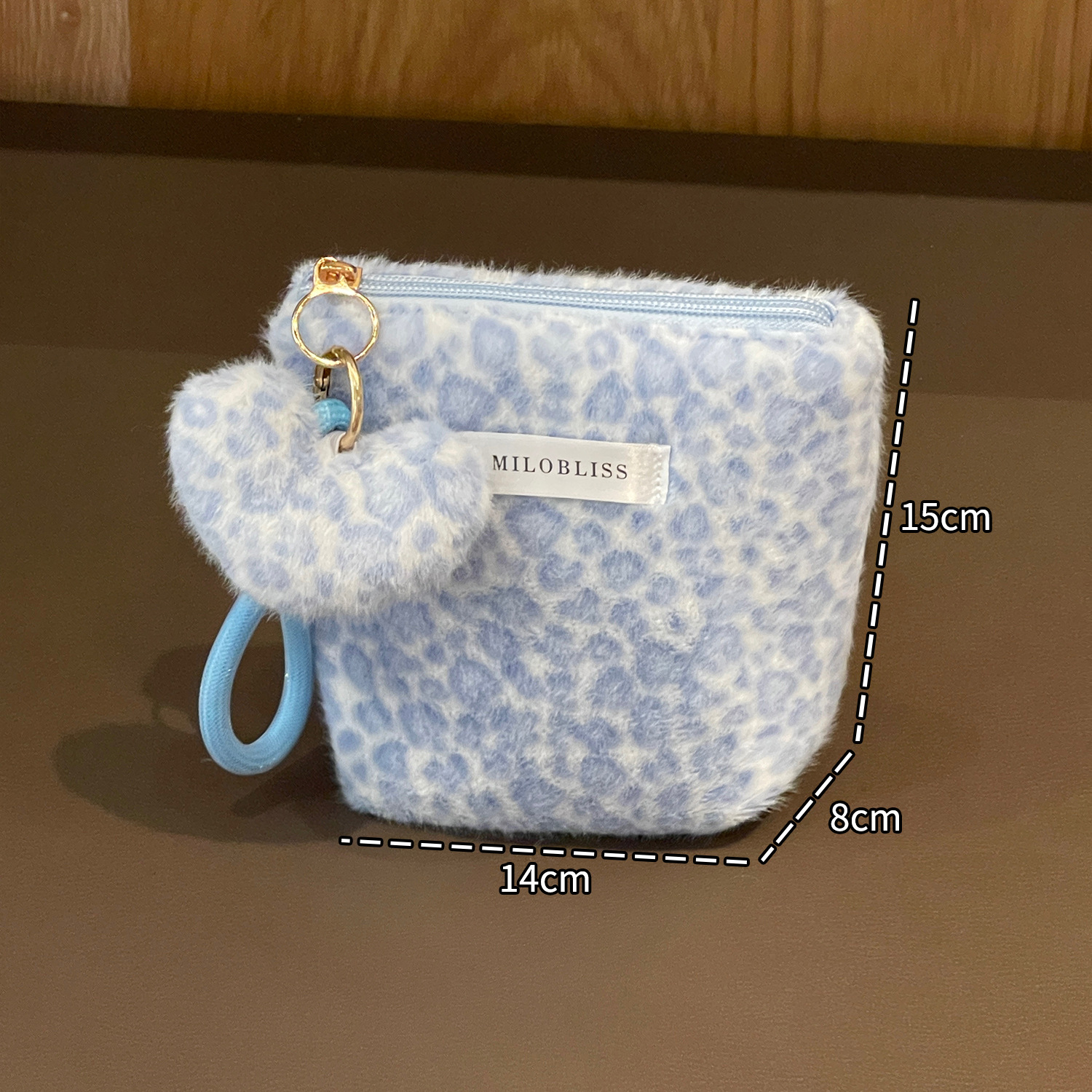 Nueva bolsa de maquillaje impresa de leopardo de peluche de pelo de conejo multifuncional portátil otoño y invierno para salir bolsa de almacenamiento de lavado de gran capacidad