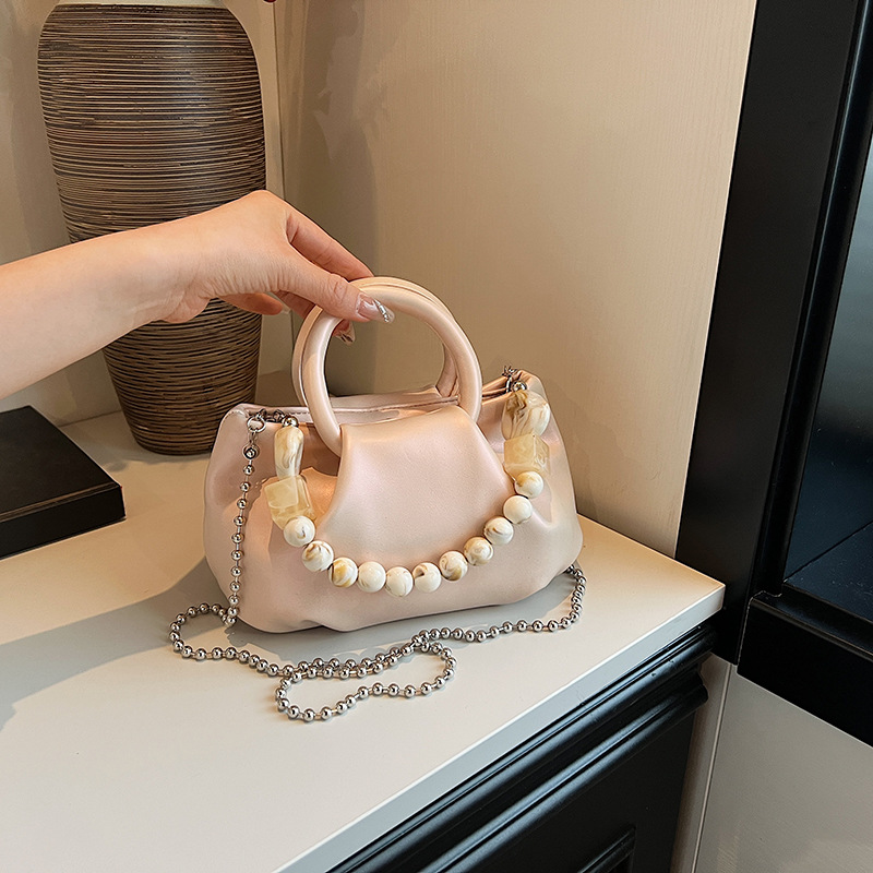 High end handbag for women in 2024, new niche design, summer handheld pleated chain strap, crossbody cloud bag_voghion.com