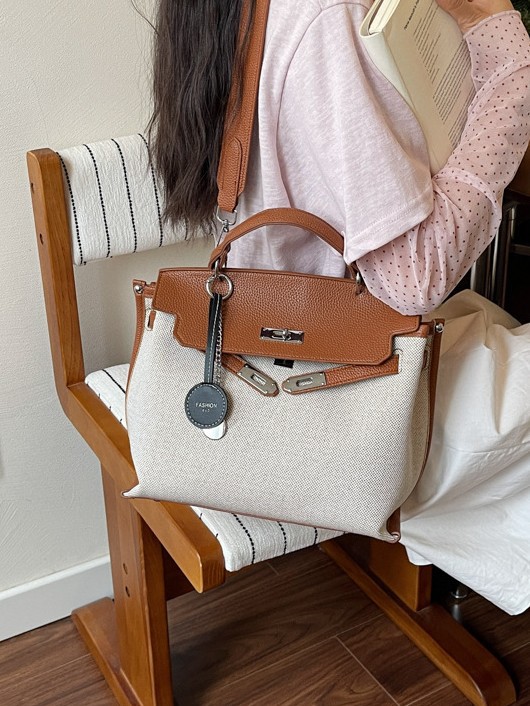 Bolso para mujeres 2026 nuevo cross-border lienzo empalme color contraste bolso de mano alta sensación retro mochila de hombro
