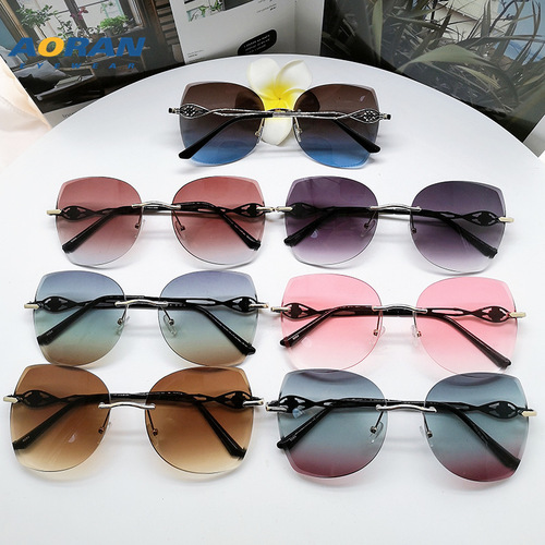 Aoran frameless edge-cut trendy cat-eye sunglasses, personalized metal marine sunglasses, fashion street photography ins glasses