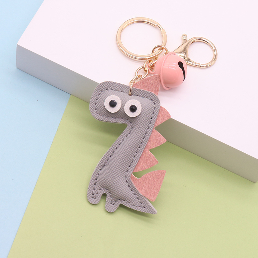 Llavero dinosaurio creativo PU bolso de cuero colgante personalizado campana de cuero llavero de coche adornos regalo