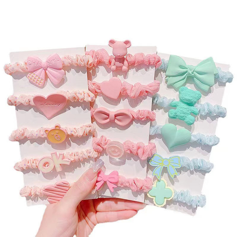 Los niños dulces de color caramelo intestino delgado banda de pelo traje de niña corbata de corazón cuerda de pelo bebé no duele banda de goma de pelo al por mayor