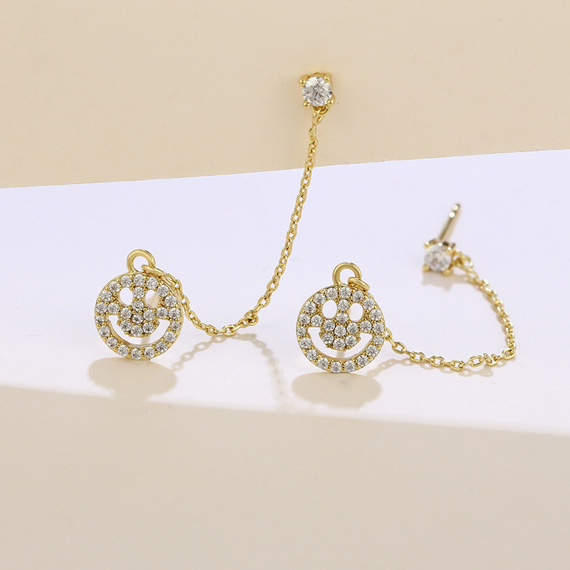 Joyas Xuping personalidad europea y americana sonriente pernos de orejas de aleación nicho ligero lujoso frío orejas de viento para mujeres exquisitas verano